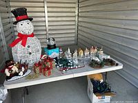 Overall lot on table inside storage unit
