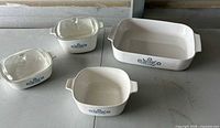 All three dishes with two lids displayed