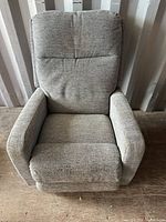 Front view of light gray fabric power lift recliner chair