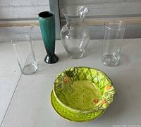 All four pieces: three vases and ceramic colander with plate