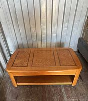 Closed coffee table showing parquet inlay and lower shelf
