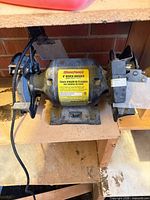 Front view of WorkForce 6" bench grinder on shelf