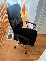 Full view of black mesh back office chair
