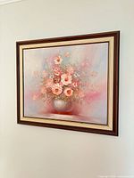 Full view of framed floral still life painting on wall