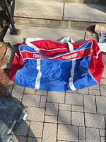 Top view of Cooper hockey bag on stone surface