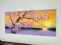 Three-panel cherry blossom tree canvas wall art displayed on wall