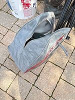 Gray vinyl bowling ball bag exterior with zipper partially open