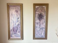 Both framed prints side by side on wall