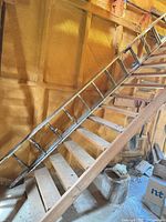 Full ladder leaned against staircase wall