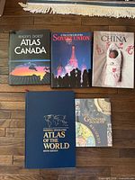 Five books laid out showing front covers