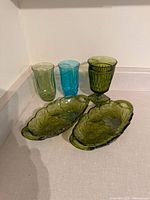 All five glass items grouped together on countertop