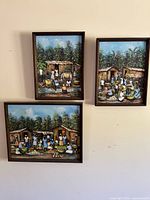 all three framed paintings on wall