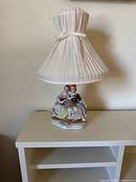 Full view of lamp with shade on table