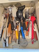 Drawer view showing entire assortment of utensils
