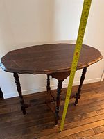 Full view of side table with tape showing height