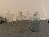 Front view of all six glass carboys