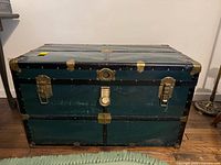 Front view closed trunk showing hardware and wear