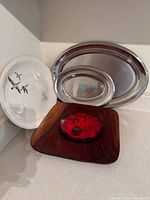 Group of all platters and trivet displayed together