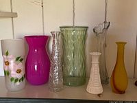 Front view of all seven vases lined up