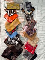 All scarves laid out lengthwise on bed