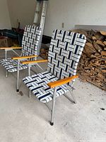 Two woven folding lawn chairs showing design, materials, and condition