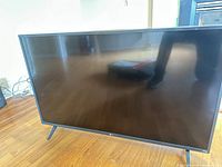 Front view powered off showing screen and stands