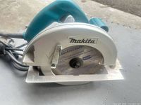 Front view of Makita circular saw showing blade, guard and handle