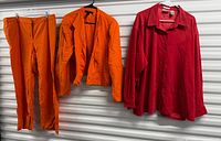 Front view of orange pants, orange blazer, red blouse