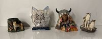 Group shot of four figurines