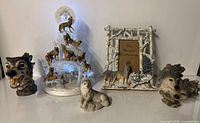 Group shot of all five wolf figurines