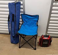 Full view of blue folding chair, carry bag, and CEN-TECH power pack