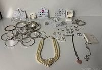 Group shot of entire jewelry lot on table