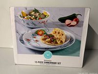Front of sealed box showing pattern and contents