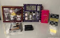All six boxed perfume and bath items displayed together