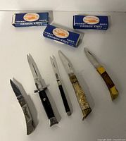 Six knives and three Hanson boxes overview