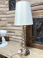 Full view of Lauren chrome lamp with white shade