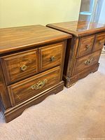 Pair of matching solid wood nightstands side by side