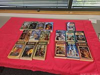 All 15 Dragonlance paperbacks laid out on table