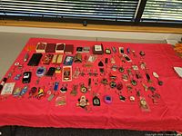 full lot overview on red cloth showing all keychains