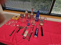 Full lot on table showing all barware and glasses