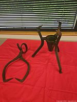 Ice tongs and tripod press/stand side by side