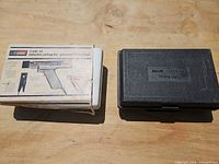 Closed white and black carry cases shown side by side
