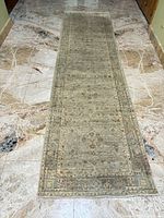Full view of runner rug laid on marble floor