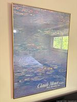Frontal view of framed Claude Monet Nymphéas print showing artwork and text