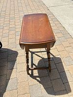 Table with leaves down showing rectangular centre panel