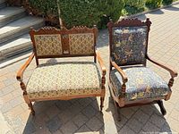 Front view of loveseat and rocker displaying upholstery patterns and wood frames