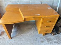 Front view showing left return, drawer stack, pencil drawer