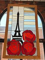 Full view of stained glass panel hanging in window