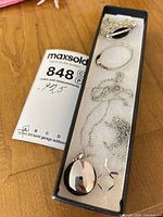 Entire lot in narrow display box showing locket, bangle, chains and pendant
