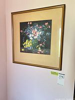Full view of framed floral print on wall